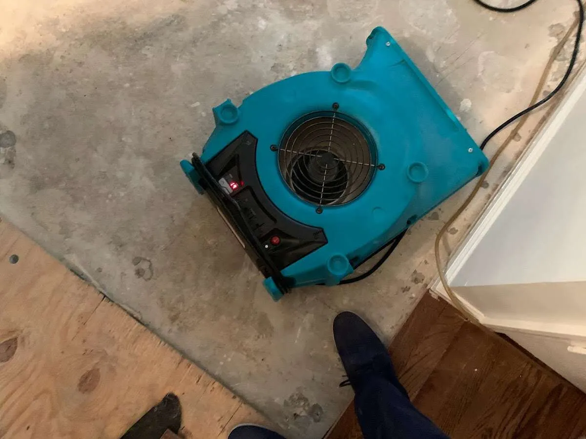 Air mover drying subfloor during Leak Detection & Repair in Maryland Heights